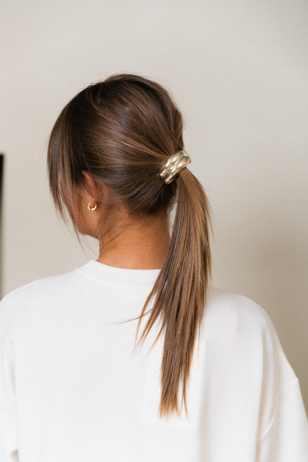 Gouden dubbel gebogen haaraccessoire met elastiek