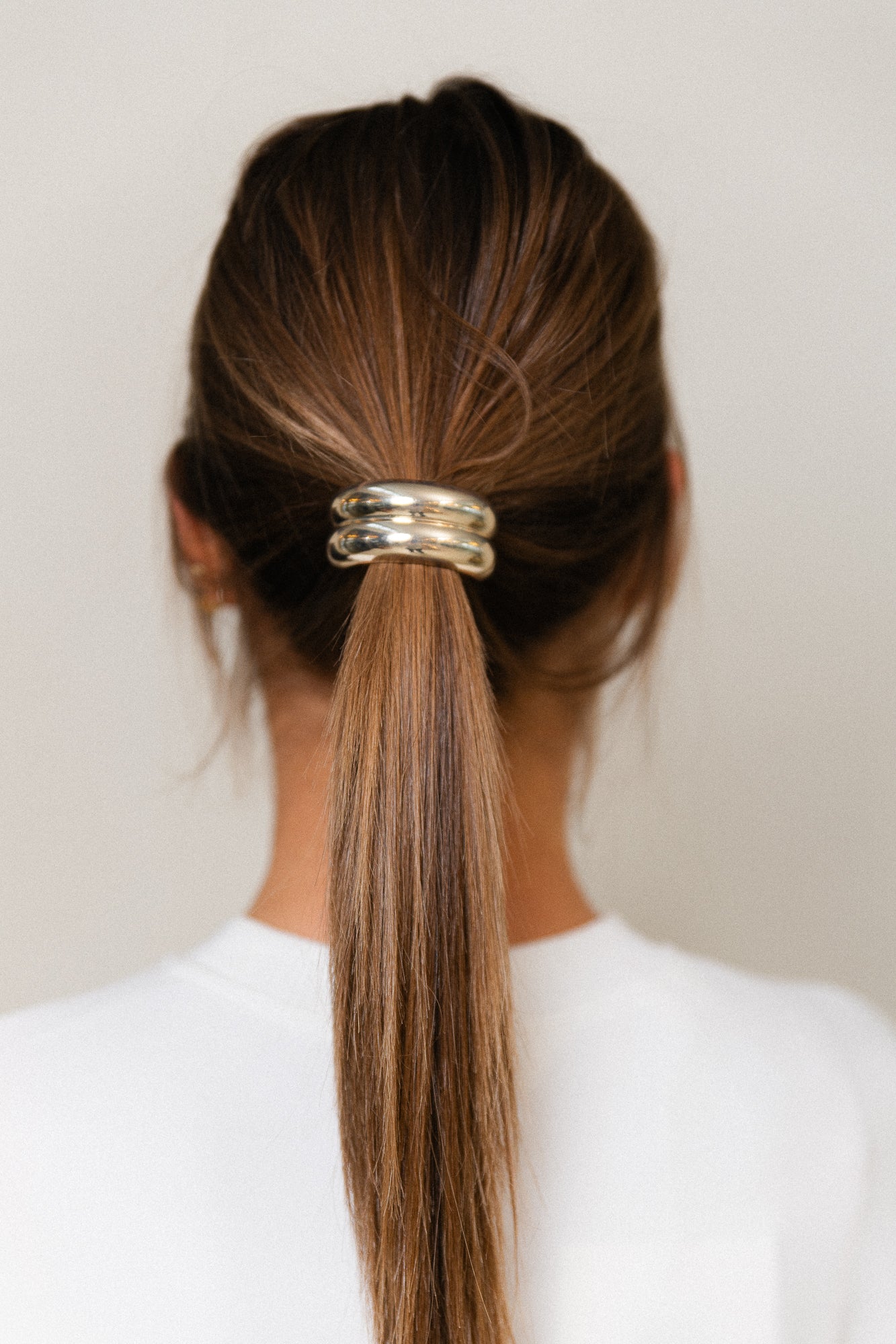 Gouden dubbel gebogen haaraccessoire met elastiek