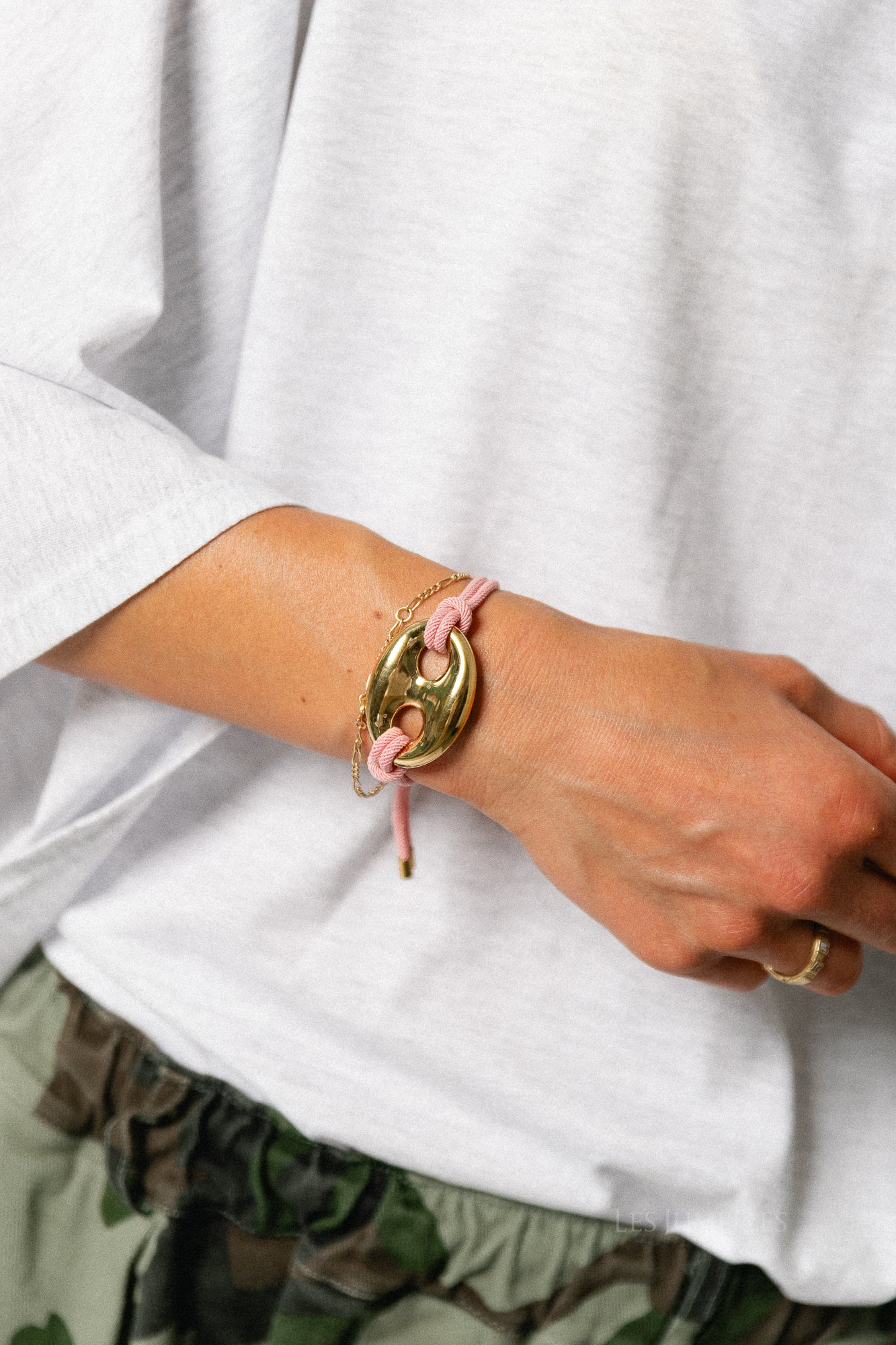 Cord bracelet with button detail dusty pink
