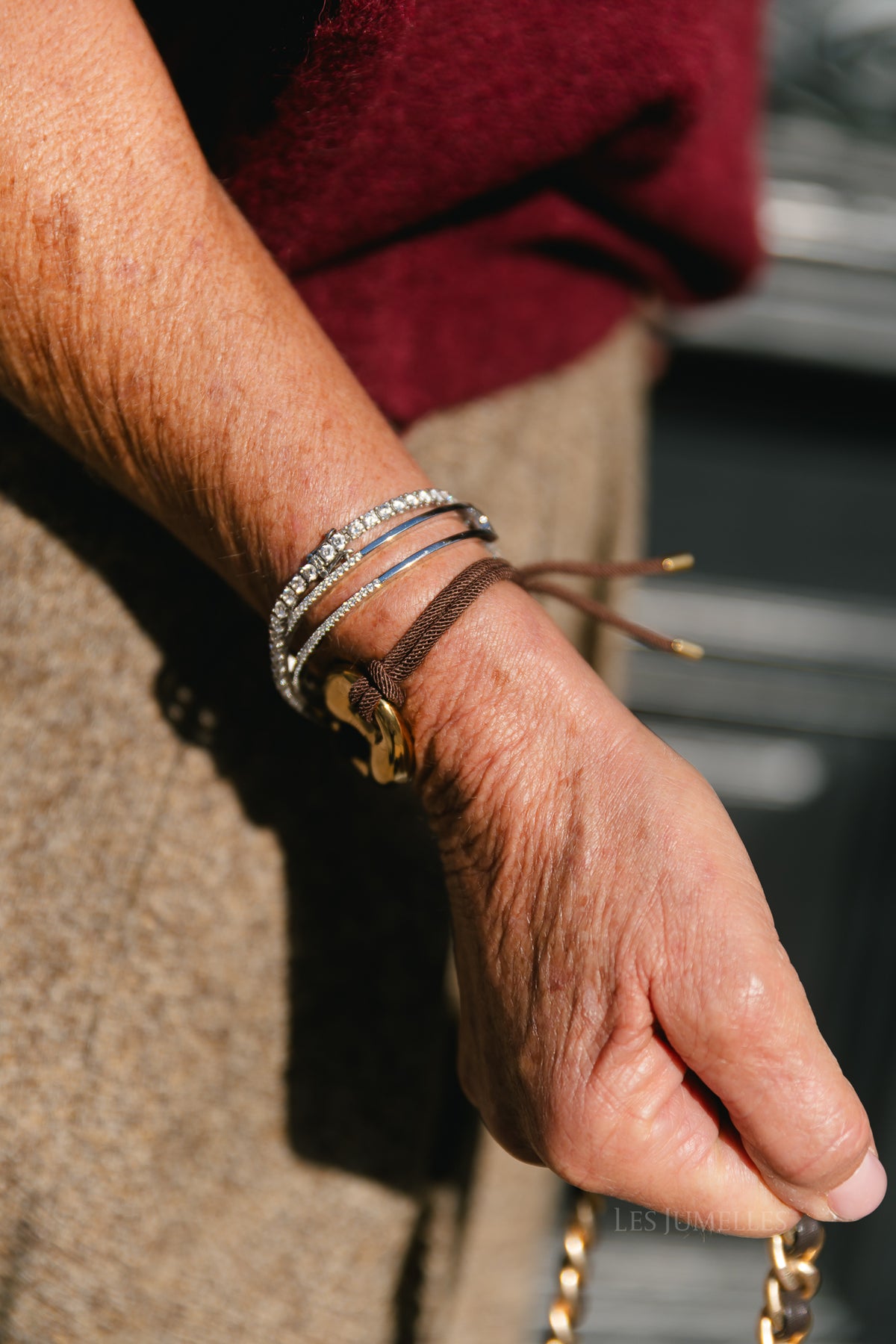 Cord bracelet with gold-tone bean detail brown